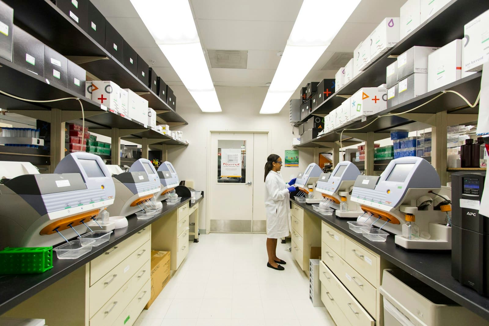 A researcher working at the bench of a university laboratory